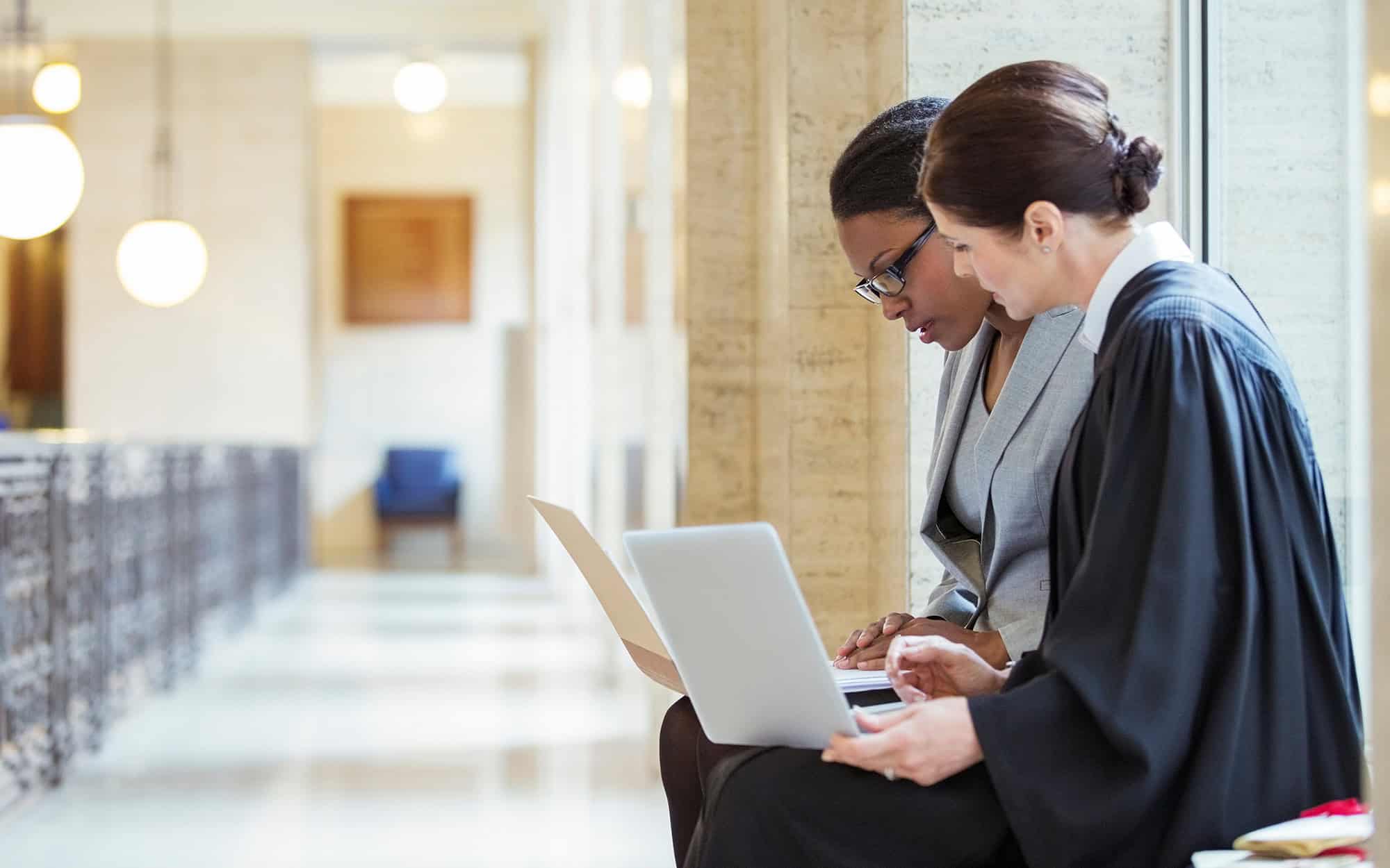 Judge And Lawyer Examining Documents Together