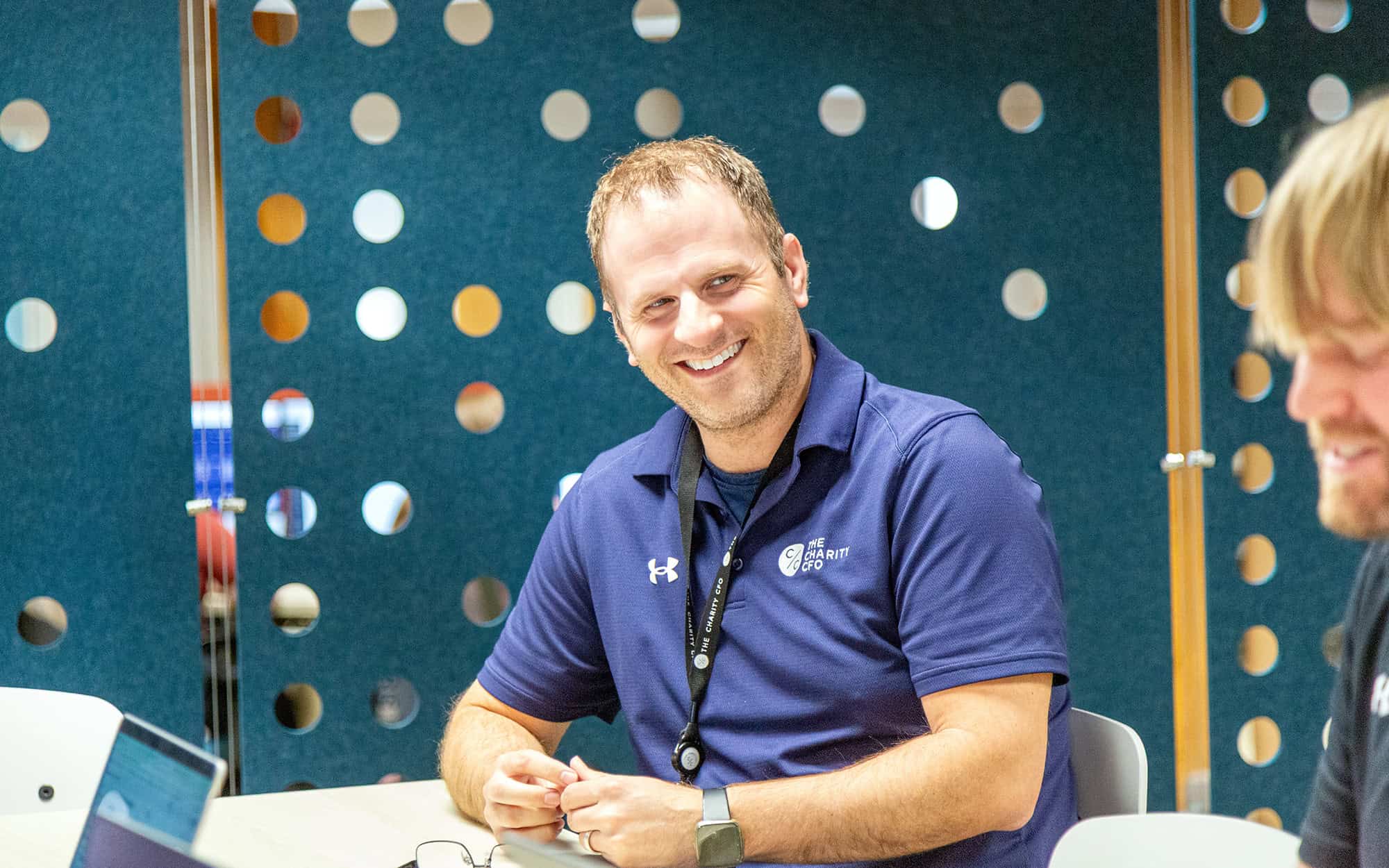 The Charity Cfo Man Smiling Wearing Blue Polo