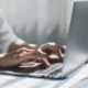 Close Up Of Businessman Or Accountant Working On Laptop Computer