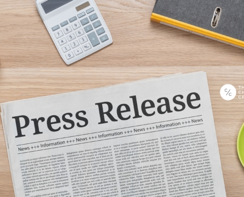 A press release document going unnoticed among a pile of papers