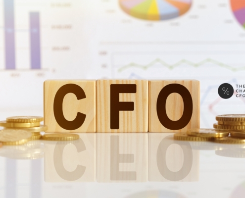 A nonprofit CFO reviewing AI-powered financial dashboards and forecasting tools with organizational leadership