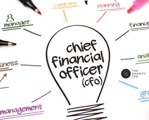 A strategic nonprofit CFO leading a financial planning discussion with executive leadership and board members